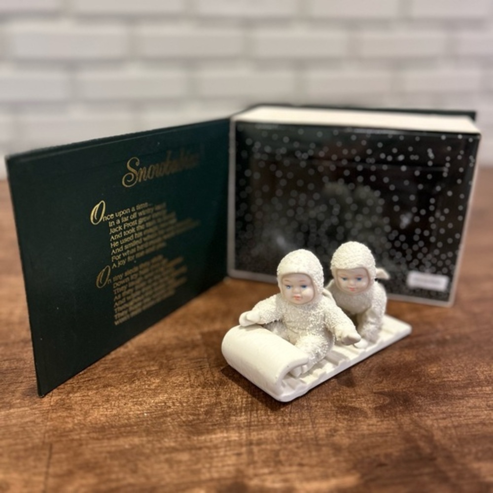 Department 56 Snowbabies figurine titled "Hold on
Tight"